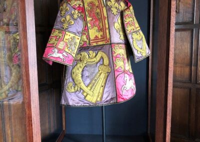 The tabard in the display case.